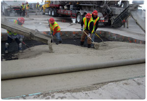 Men placing Rapid Set concrete